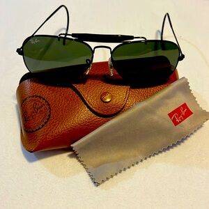 Black Ray Ban wrap around ear sunglasses